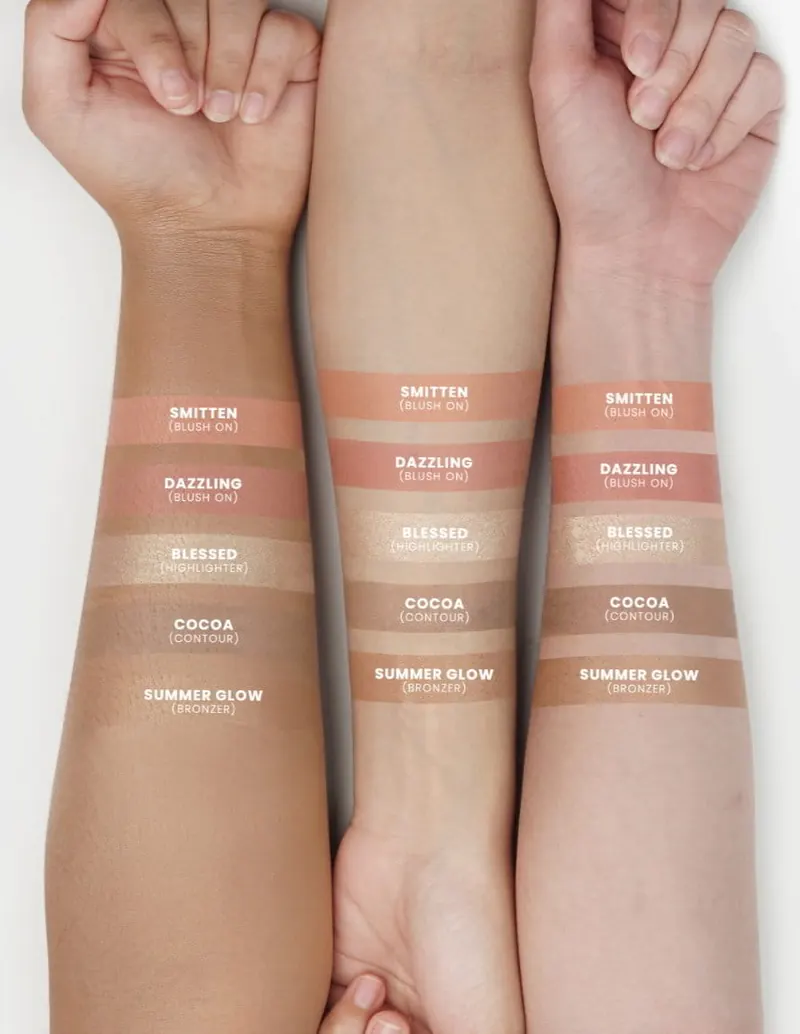 Swatch Smitten, Dazzling, Blessed, Cocoa dan Summer Glow di tiga lengan dengan warna kulit berbeda
