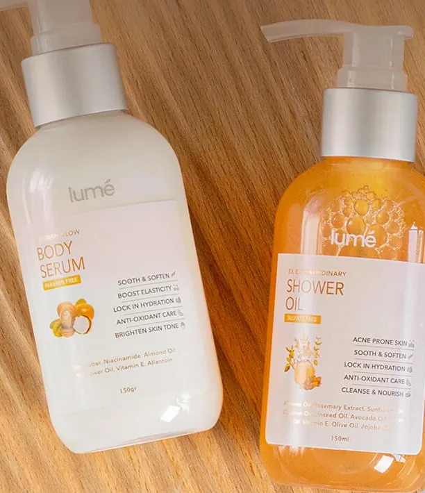 Lume Body Serum 150 gr dan Shower Oil 150 mL di atas papan kayu